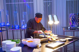 A banquet chef plating dishes