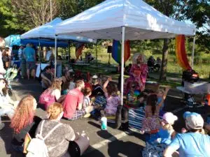 A group of people under a tent at Bloomington Pride
