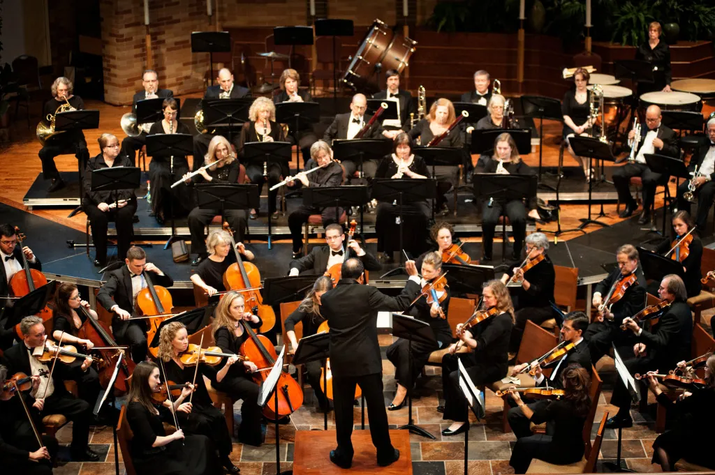A symphony playing their instruments