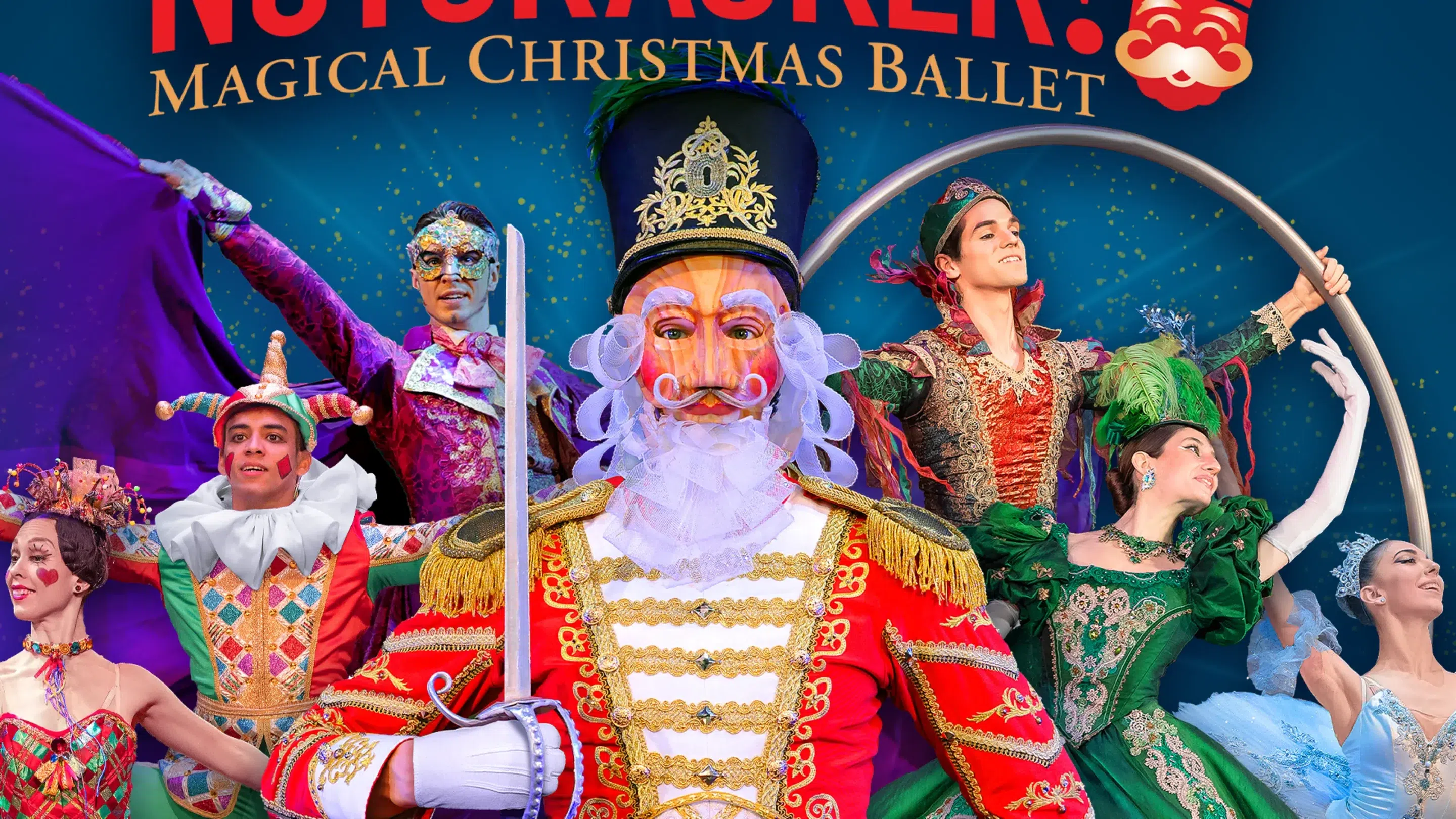 A nutcracker stands in front with ballet dancers behind him.