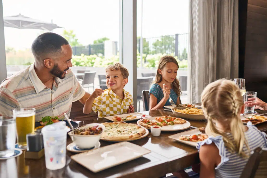 A family of 4 dining at Cedar + Stone, Urban Table.