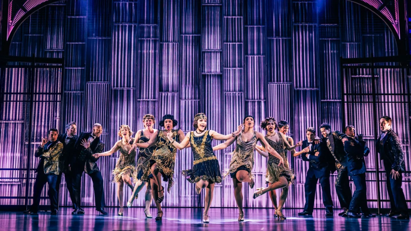 A line of dancers in flapper costumes