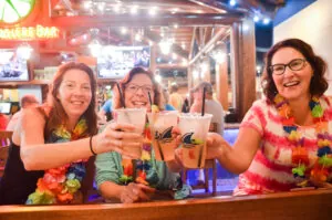 3 ladies cheersing drinks at Margaritaville
