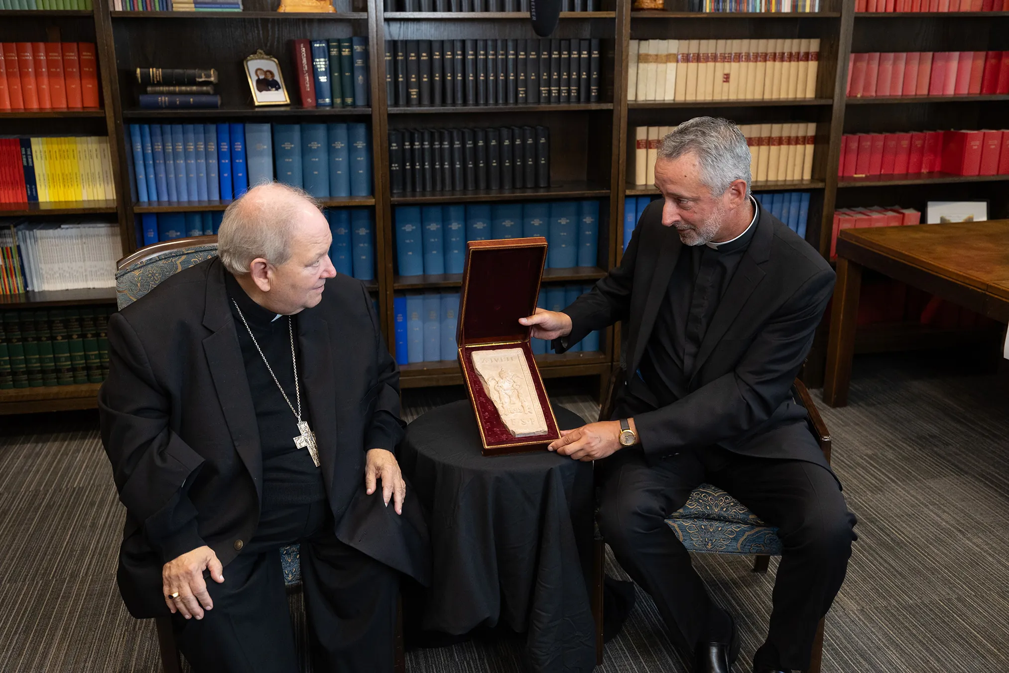 image of archbishop hebda and father kunst promoting vatican unveiled at mall of america
