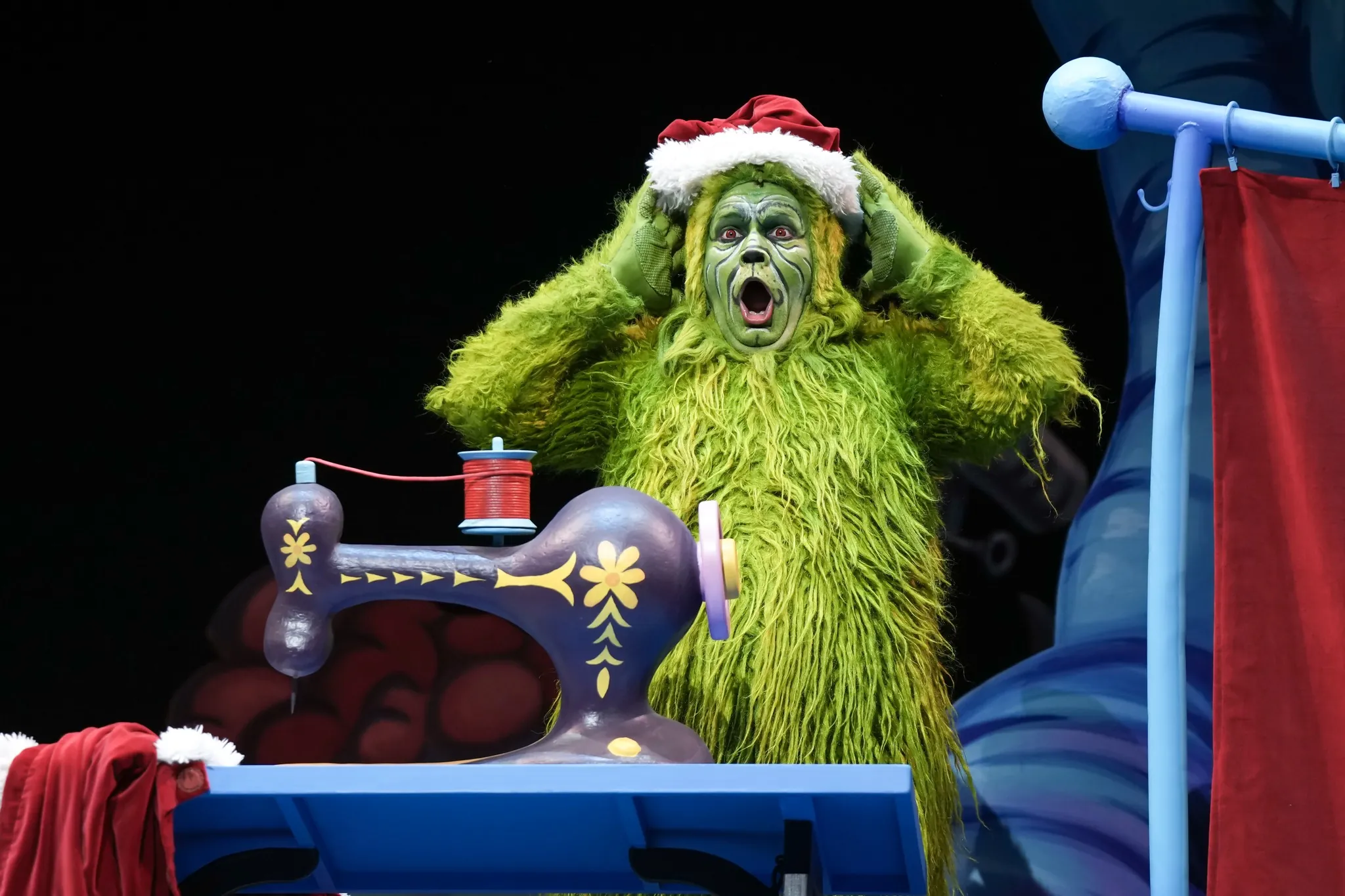 A photo of the Grinch during the live production of How The Grinch Stole Christmas.