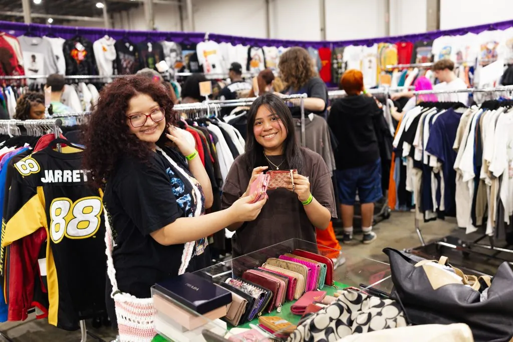 Two people shopping for vintage goods at Totally Rad Vintage Fest. Photo Credit: Totally Rad Vintage Fest