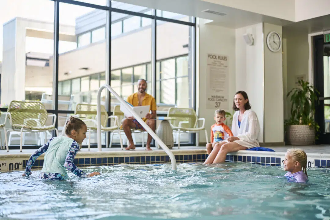 image of family at a hotel pool